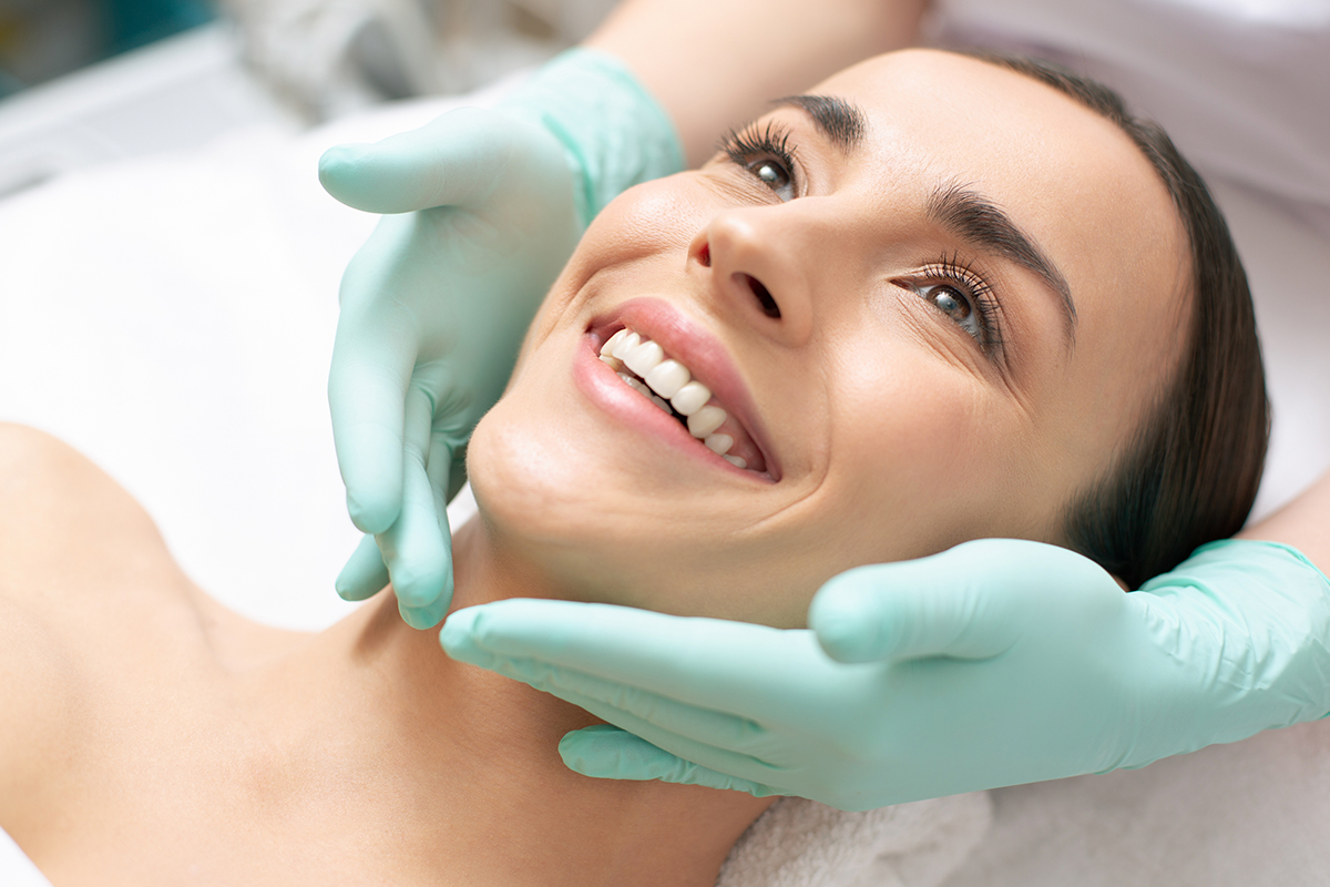 Woman happily undergoing rosacea treatment in Palo Alto.